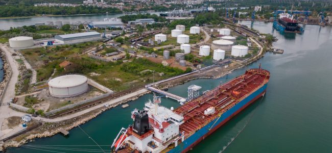 Aerial view of oil ship tanker and lpg ship at industrial port Aerial top view of oil ship tanker and lpg ship at industrial port